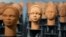 Sculptures created by French artist Prune Nourry representing the approximately 100 Chibok schoolgirls still in captivity are displayed in Lagos, Nigeria, Dec. 13, 2022. 