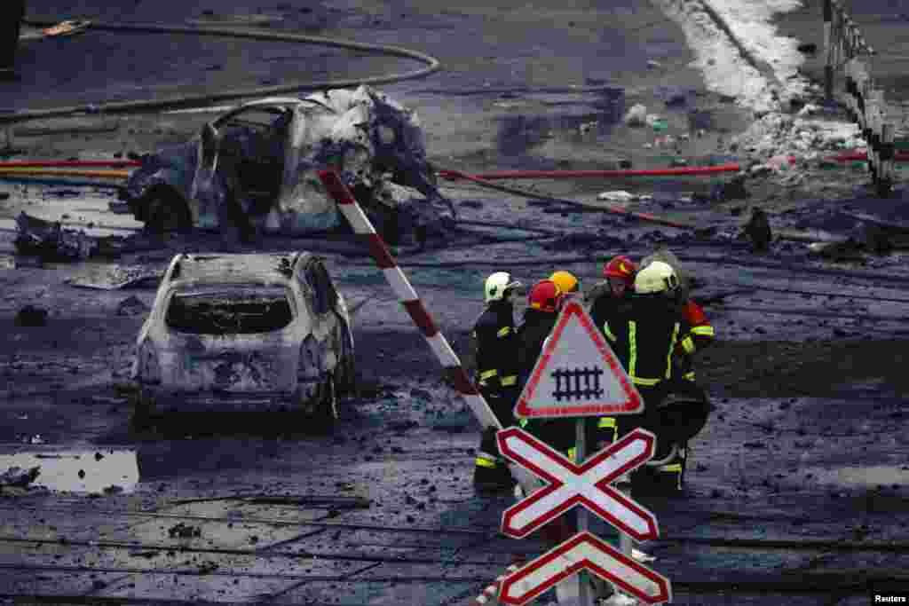 Rescuers work at a site of a Russian missile strike in Kyiv, Ukraine.