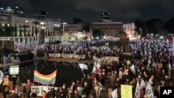 Israelis in Tel Aviv, Israel, protest the government's plans to overhaul the country's legal system, Jan. 14, 2023.