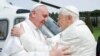 FILE - Pope Francis (L) embraces Pope Emeritus Benedict XVI as he arrives at the Castel Gandolfo summer residence, Italy, March 23, 2013. 