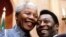 FILE- President Nelson Mandela and Brazilian soccer legend Pele smile for photographers at Union Buildings in Pretoria, South Africa, March 1995.