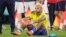 Brazil's Neymar sits on the pitch at the end of the World Cup quarterfinal soccer match against Croatia in Al Rayyan, Qatar, Dec. 9, 2022.