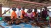 FILE - Members of the Wate Na Kita women’s group pictured at a fish market in Terekeka county, Central Equatoria state, South Sudan, Nov. 18, 2022. (VOA/Juliana Siapai)