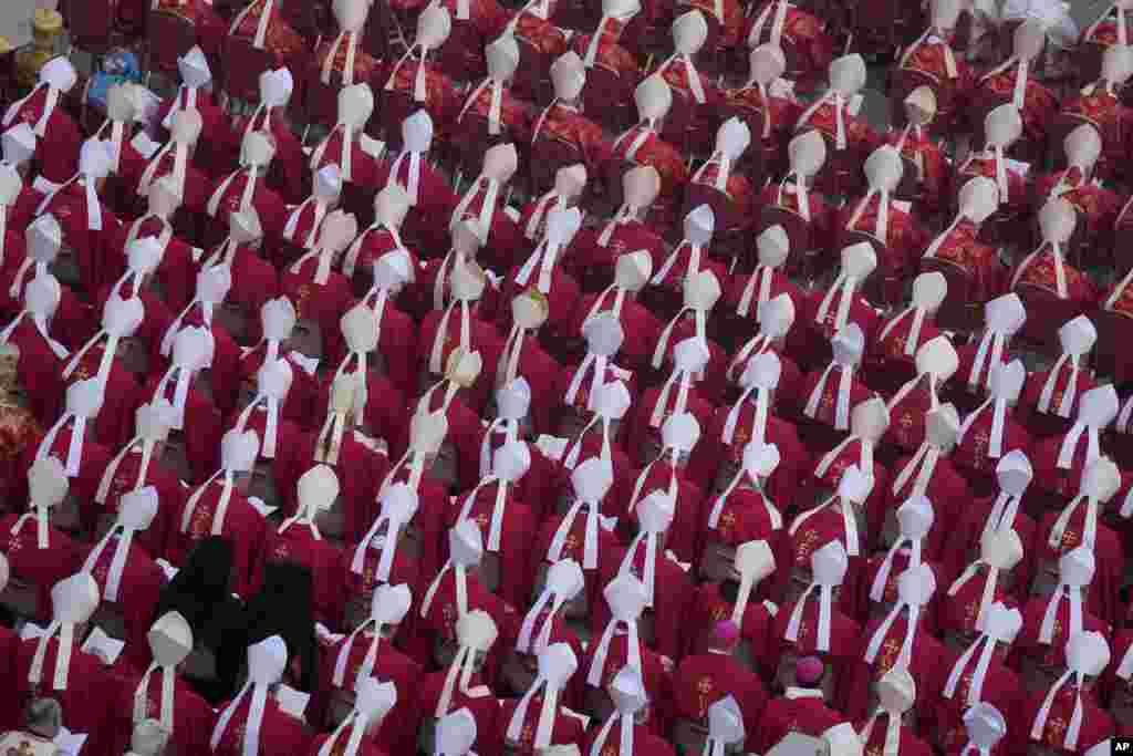 Members of the church attend the funeral mass for late Pope Emeritus Benedict XVI in St. Peter's Square at the Vatican, Jan. 5, 2023.