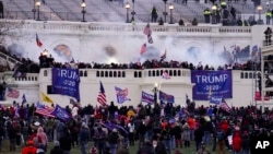 FILE - Rioters are seen at the U.S. Capitol on Jan. 6, 2021, in Washington. 