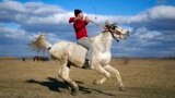 
A man rides a horse during Epiphany celebrations in the village of Pietrosani, Romania.