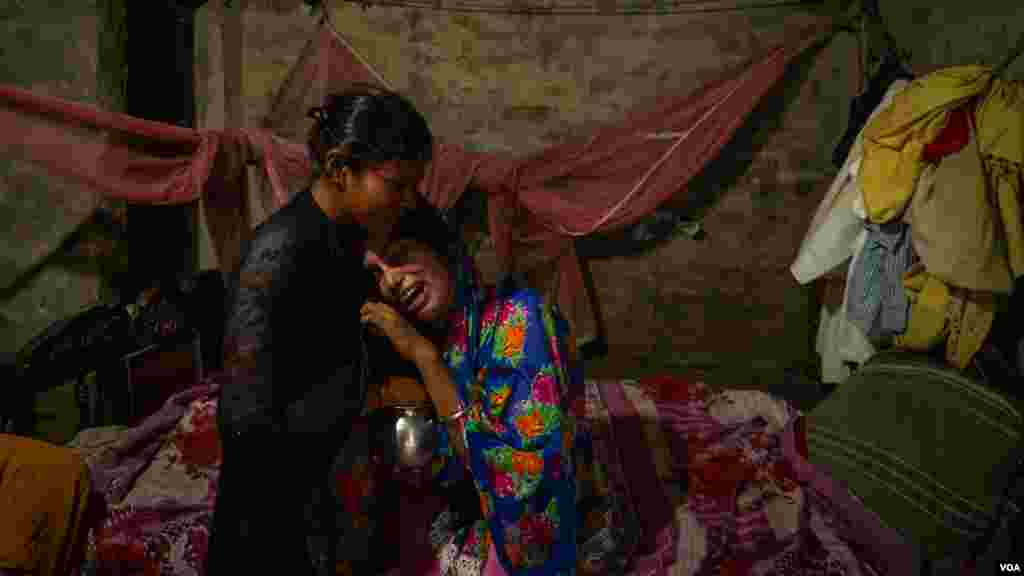 The widow and the sister of Bir Bahadur Pasman cry when asked about the days they spent together before he left for Qatar. His family was told that the 26-year-old hanged himself in Doha, but they do not believe it, in the Dhanusha district of Nepal, Augu