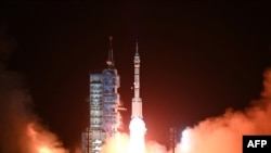 A Long March-2F carrier rocket, carrying the Shenzhou-15 spacecraft with three astronauts to China's Tiangong space station, lifts off from the Jiuquan Satellite Launch Center in Northwest China's Gansu Province late on Nov. 29, 2022.