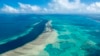 FILE - In this undated photo provided by the Great Barrier Reef Marine Park Authority, the Great Barrier Reef near the Whitsunday, Australia, region is viewed from the air. 