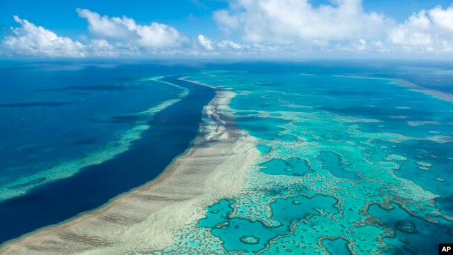 FILE - In this undated photo provided by the Great Barrier Reef Marine Park Authority, the Great Barrier Reef near the Whitsunday, Australia, region is viewed from the air.