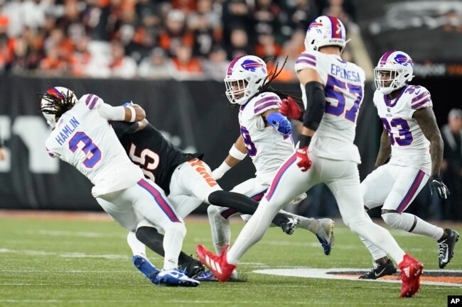 Cincinnati Bengals wide receiver Tee Higgins (85) collides with Buffalo Bills safety Damar Hamlin (3) during the first half of an NFL football game, Monday, Jan. 2, 2023, in Cincinnati. (AP Photo/Joshua A. Bickel)