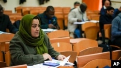 Batool Haidari, 37, attends an Italian language class, in Rome, Dec. 5, 2022.