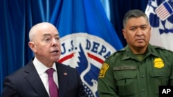 Homeland Security Secretary Alejandro Mayorkas, left, standing next to U.S. Border Patrol Chief Raul Ortiz, speaks during a news conference in Washington, Jan. 5, 2023, on new border enforcement measures.