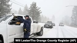 Massive US storm brings tornadoes to South, blizzard threat