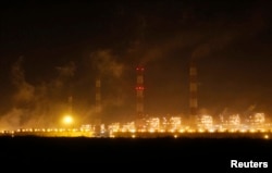 FILE - Power plants of Adani Power are seen at Mundra town in the western Indian state of Gujarat, April 1, 2014.