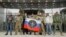 FILE: Visitors pose for a picture outside PMC Wagner Centre, which is a project implemented by the businessman and founder of the Wagner private military group Yevgeny Prigozhin, during the official opening of the office block in Saint Petersburg, Russia. taken Nov.4, 2022.