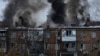 Ukrainian State Emergency Service firefighters work to extinguish a fire at the scene of a Russian shelling in the town of Vyshgorod outside of the capital Kyiv, Ukraine, Nov. 23, 2022. 