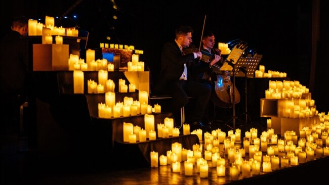 Musicians perform during a candlelight concert at the Architect's House in Kyiv, Ukraine, on Dec. 1, 2022, amid the Russian invasion of Ukraine.