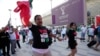 Protesters wear T-shirts reading 'Rise with the women of Iran' outside the Ahmad Bin Ali Stadium at the end of the World Cup group B soccer match between Wales and Iran, in Al Rayyan, Qatar, Nov. 25, 2022.