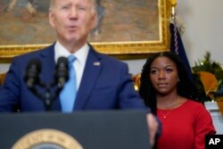 Cherelle Griner, wife of WNBA star Brittney Griner, listens as President Joe Biden announces Brittney Griner's release in a prisoner swap with Russia, in the Roosevelt Room of the White House in Washington, Dec. 8, 2022. (AP Photo/Patrick Semansky)