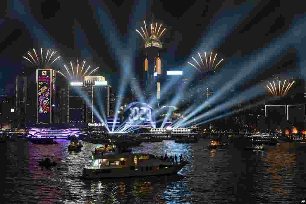 Fireworks are seen over Victoria Harbour at midnight on New Years, Jan. 1, 2023, in Hong Kong.