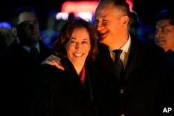 FILE - Vice President Kamala Harris and second gentleman Doug Emhoff attend the lighting ceremony for the National Christmas Tree on the Ellipse of the White House in Washington, Nov. 30, 2022.