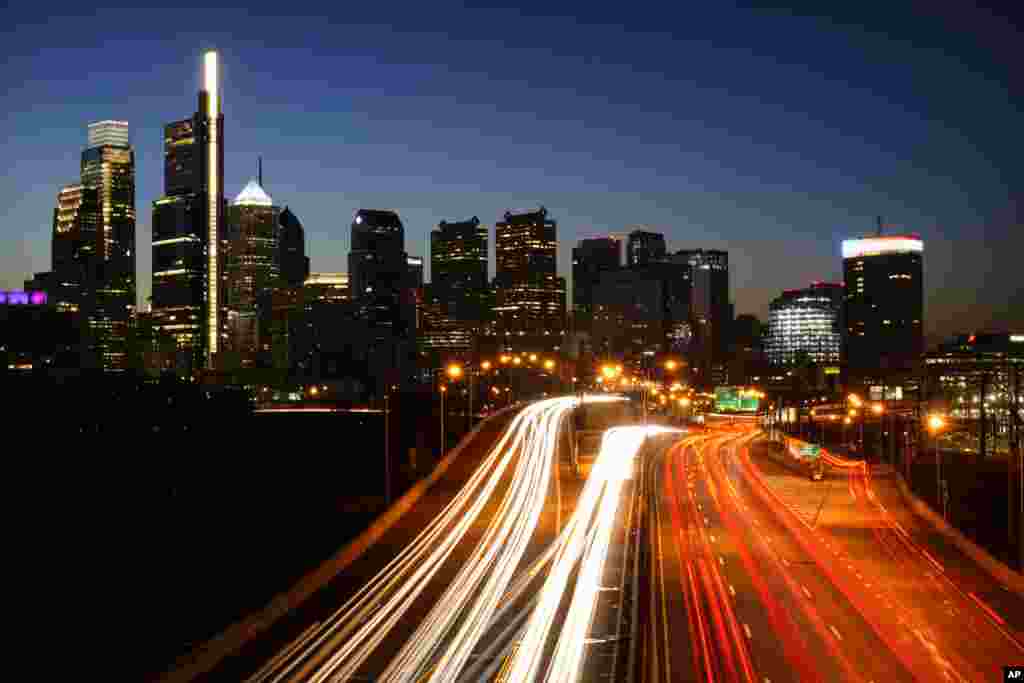 In this image made with a long exposure, motor vehicles move along Interstate 76 ahead of the Thanksgiving Day holiday in Philadelphia, Pennsylvania.