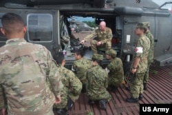 FILE - US and Japan Ground Self-Defense Force soldiers take part in a joint training exercise at Camp Fuji, Japan, Sept. 13, 2017.