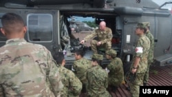 FILE - US and Japan Ground Self-Defense Force soldiers take part in a joint training exercise at Camp Fuji, Japan, Sept. 13, 2017. 