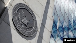 FILE - The seal of the U.S. Securities and Exchange Commission (SEC) is seen at their headquarters in Washington, May 12, 2021.