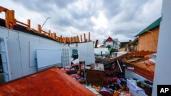 A local business destroyed by a tornado that passed through downtown Selma, Alabama on January 12, 2023 is littered with debris.