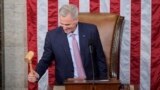 Incoming House Speaker Kevin McCarthy of Calif., holds the gavel after accepting it from House Minority Leader Hakeem Jeffries of N.Y., on the House floor at the U.S. Capitol in Washington, Jan. 7, 2023.