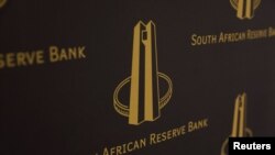 FILE: The logo of South Africa's central reserve bank is seen during the delivery of a keynote address by South Africa's central bank governor, Lesetja Kganyago, at the University of the Witwatersrand in Johannesburg, South Africa, November 1, 2022.