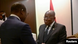 Ghana's President Nana Akufo-Addo, right, greets Benin's President Patrice Talon during bilateral meetings at the Accra Initiative regional security conference in Accra, Ghana, Nov. 22, 2022.