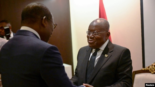 Ghana's President Nana Akufo-Addo, right, greets Benin's President Patrice Talon during bilateral meetings at the Accra Initiative regional security conference in Accra, Ghana, Nov. 22, 2022.