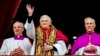 FILE - Pope Benedict XVI, flanked by Monsignor Francesco Camaldo, left, and Bishop Piero Marini, greets the crowd from the central balcony of St. Peter's Basilica at the Vatican soon after his election on April 19, 2005. 