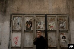 Yousef Mesheh, 15, who was detained along with his brother in a 3 a.m. raid by Israeli forces, stands in an alleyway in the Balata Refugee Camp in the northern West Bank, Tuesday, Jan. 10, 2023.