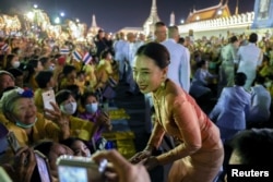 FILE - Thailand's Princess Bajrakitiyabha Narendira Debyavati greets royalists, at The Grand Palace in Bangkok, Thailand, Nov. 1, 2020.