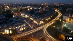 FILE - This photograph taken on April 18, 2013 shows the Indian capital's skyline as traffic drives around the outer circle of Connaught Place in the heart of New Delhi. 