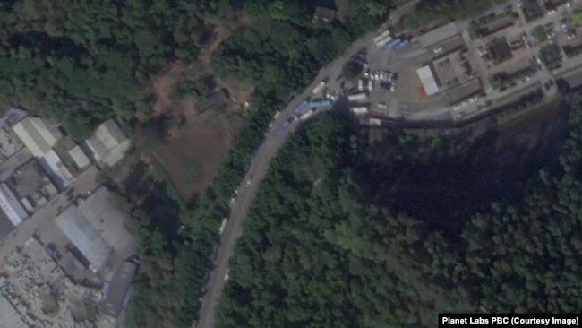 A satellite image from Dec 26, 2022, shows vehicles gathering outside a funeral home in Panyu District, Guangzhou.