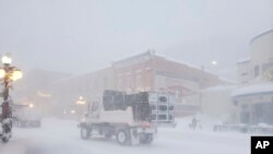 This image provided by Historic Bullock Hotel Manager Vicki Weekly shows snow piled up in front of the Historic Bullock Hotel in Deadwood, South Dakota, Dec. 15, 2022.