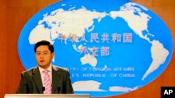 FILE - Then Chinese Foreign Ministry spokesman Qin Gang speaks at a media briefing in Beijing, July 5, 2007.