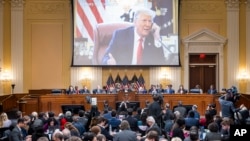 A video of former President Donald Trump is shown on a screen, as the House select committee investigating the Jan. 6 attack on the U.S. Capitol holds its final meeting on Capitol Hill in Washington, Monday, Dec. 19, 2022.
