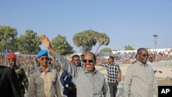 FILE: Somalia President Hassan Sheikh Mohamud leads a demonstration at Banadir stadium, Mogadishu, Thursday Jan. 12, 2023. The government rally encouraged an uprising against the al-Shabab group amid a month long military offensive.