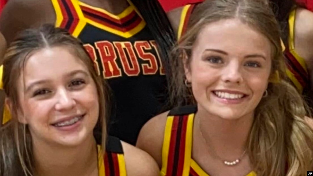 In this image provided by Janae Montgomery, Caroline Gill, left, and Maggie Dunn are shown in their cheerleading uniforms at Brusly High School in Brusly, Louisiana. Gill and Dunn were killed Dec. 31, 2022, when the car they were riding in was struck by a police car.