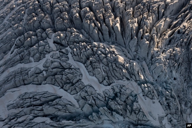 A glacier is seen from Garrett Fisher's plane in Norway, on July 29, 2022. (AP Photo/Bram Janssen)