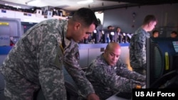 FILE A US Army captain explains predictions of space interference to a fellow Army officer March 10, 2015, in the Republic of Korea Air and Space Operation Center during exercise Key Resolve at Osan Air Base.