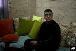 Yousef Mesheh, 15, recalls that he was sleeping when Israeli forces stormed into his home at 3.a.m., in the Balata Refugee Camp in the northern West Bank, taking him and his brother into custody, Jan. 10, 2023.