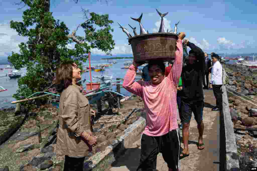 U.S. Vice-President Kamala Harris visits the village of Tagburos and learns about unsustainable fishing, in Palawan, Philippines.