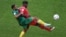 Switzerland's Breel Embolo fights for the ball with Cameroon's Jean-Charles Castelletto during the World Cup group G soccer match at the Al Janoub Stadium in Al Wakrah, Qatar, Nov. 24, 2022.